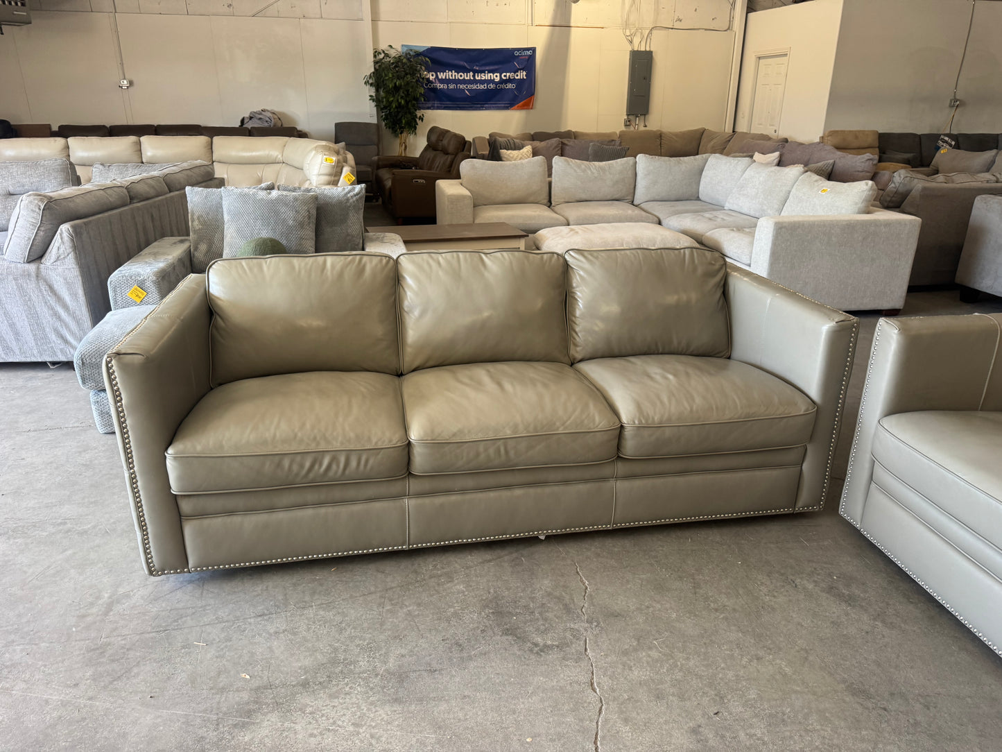 Gray Leather Couch with Ornate Nailhead Trim