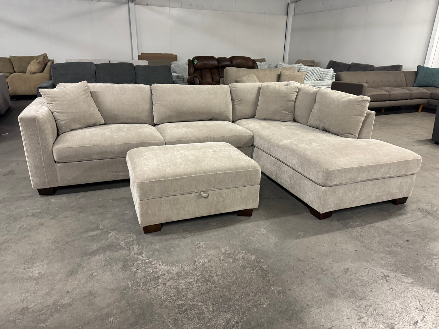 Like New Taupe Sectional with Storage Ottoman