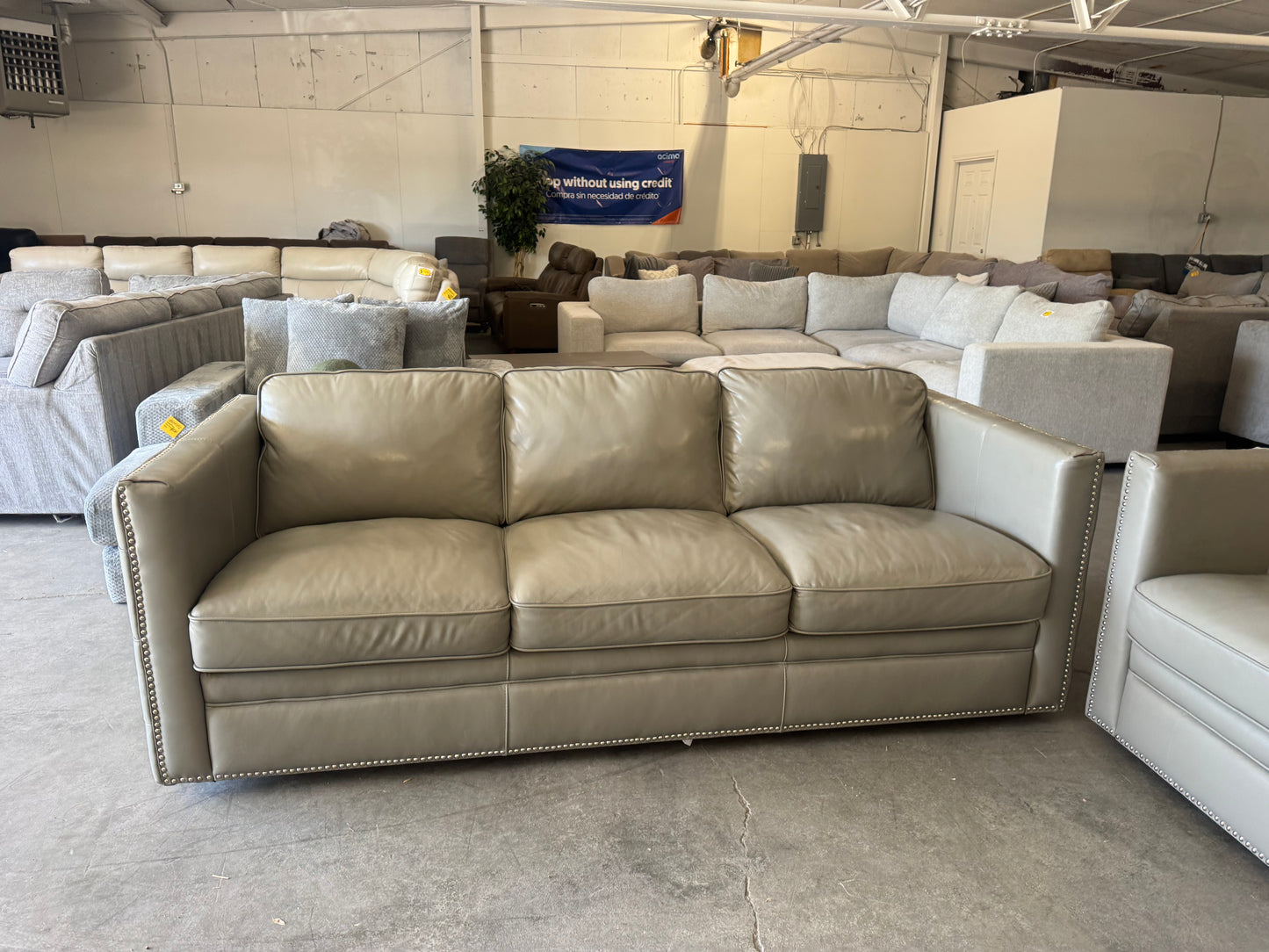 Gray Leather Couch with Ornate Nailhead Trim