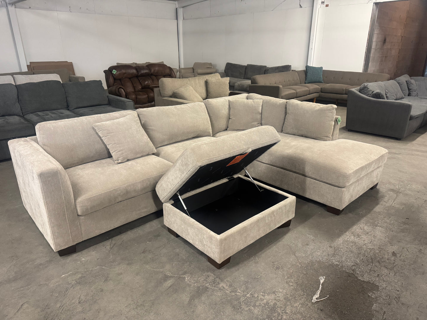 Like New Taupe Sectional with Storage Ottoman